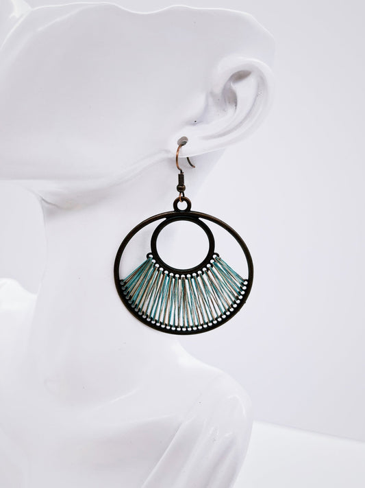 Denim Blue Fan Woven Hoop Earring on mannequin display