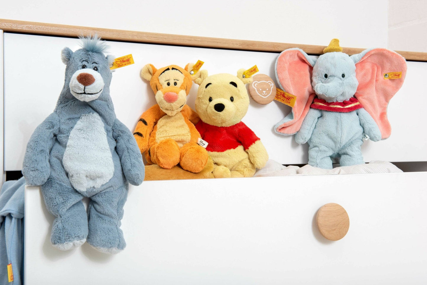 a group of winnie the pooh stuffed animals