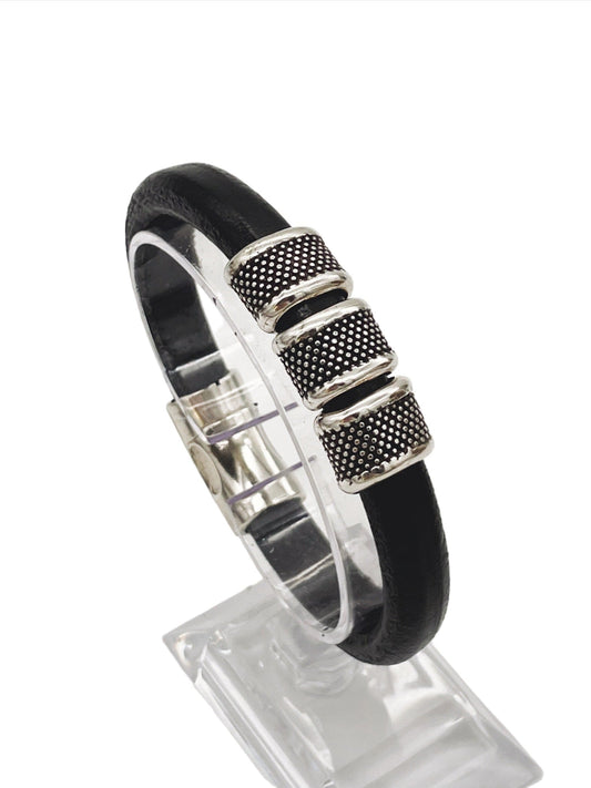 a black leather bracelet with silver accents