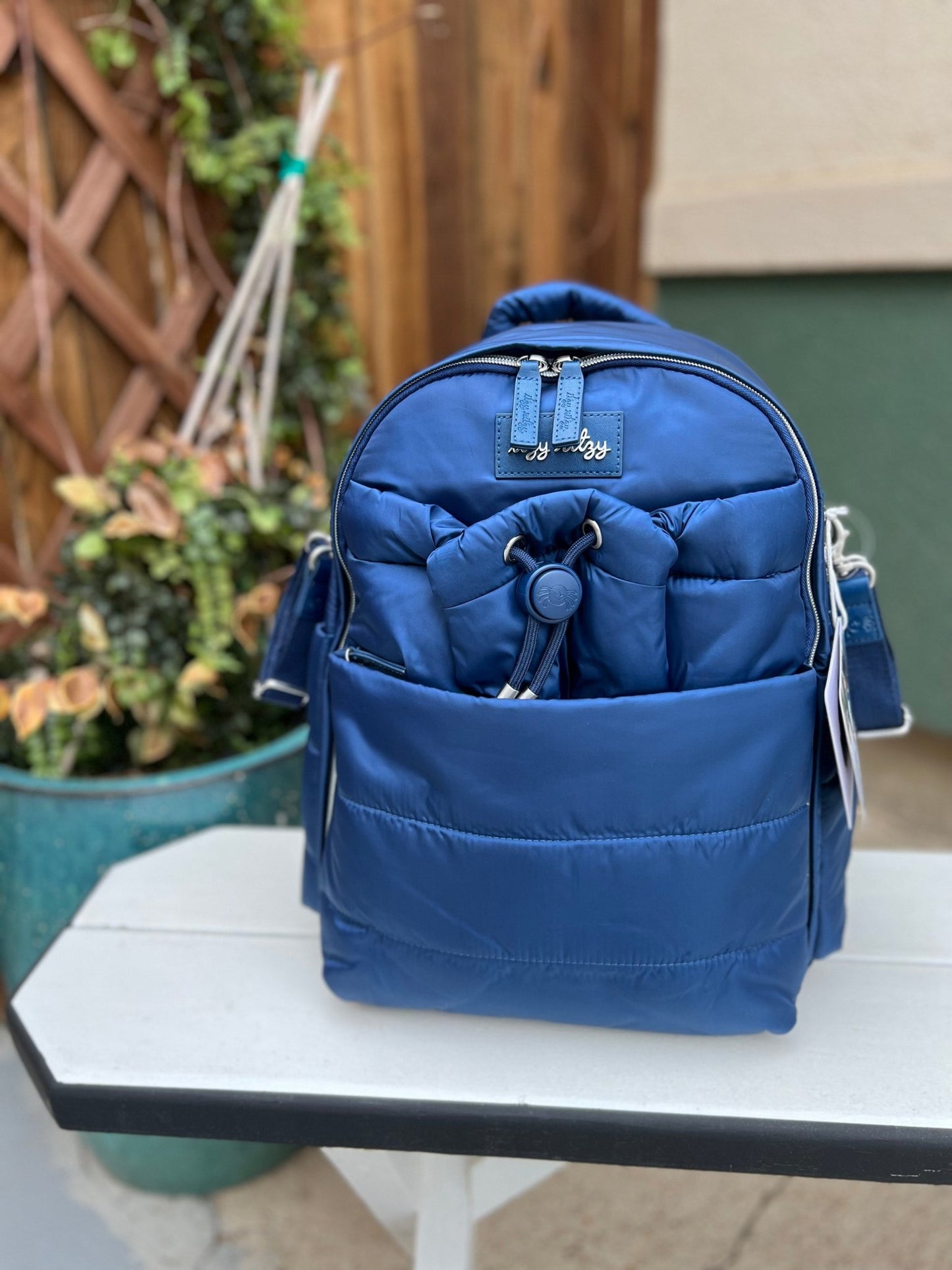 a blue diaper bag.