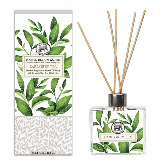 Earl Grey Home Fragrance Reed Diffuser by Michel Design Works, featuring a glass decanter with a botanical design and wooden reeds, perfect for adding a soothing tea scent to any room.