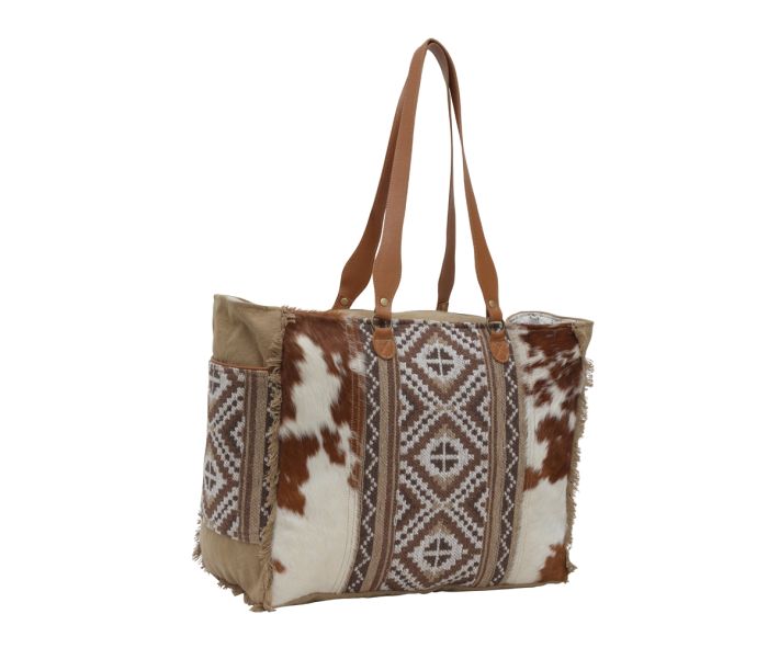 a brown and white tote bag on a white background