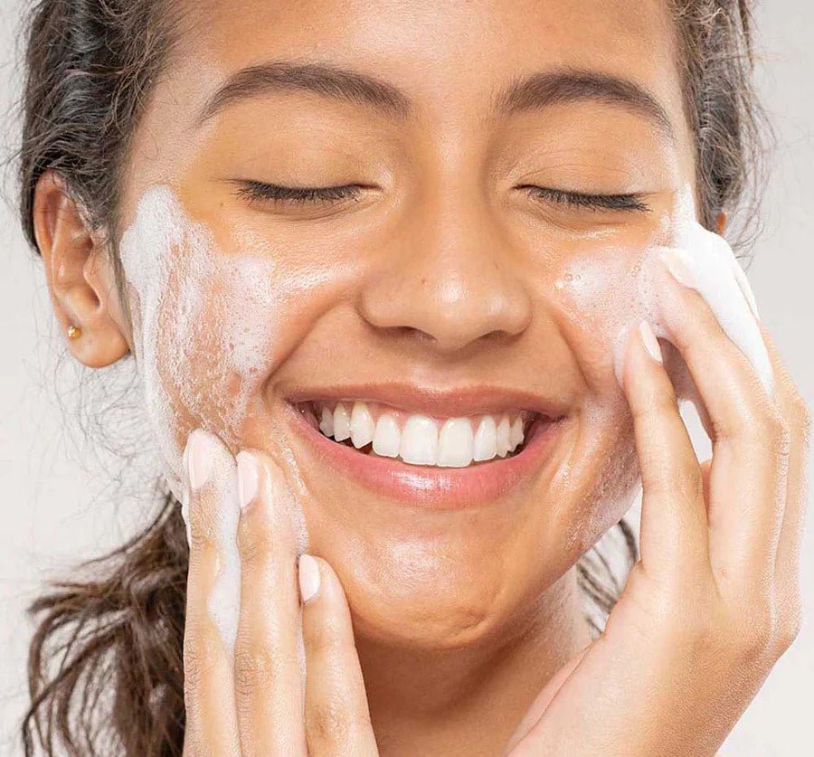 a woman with face wash on her face and face wash on her cheek