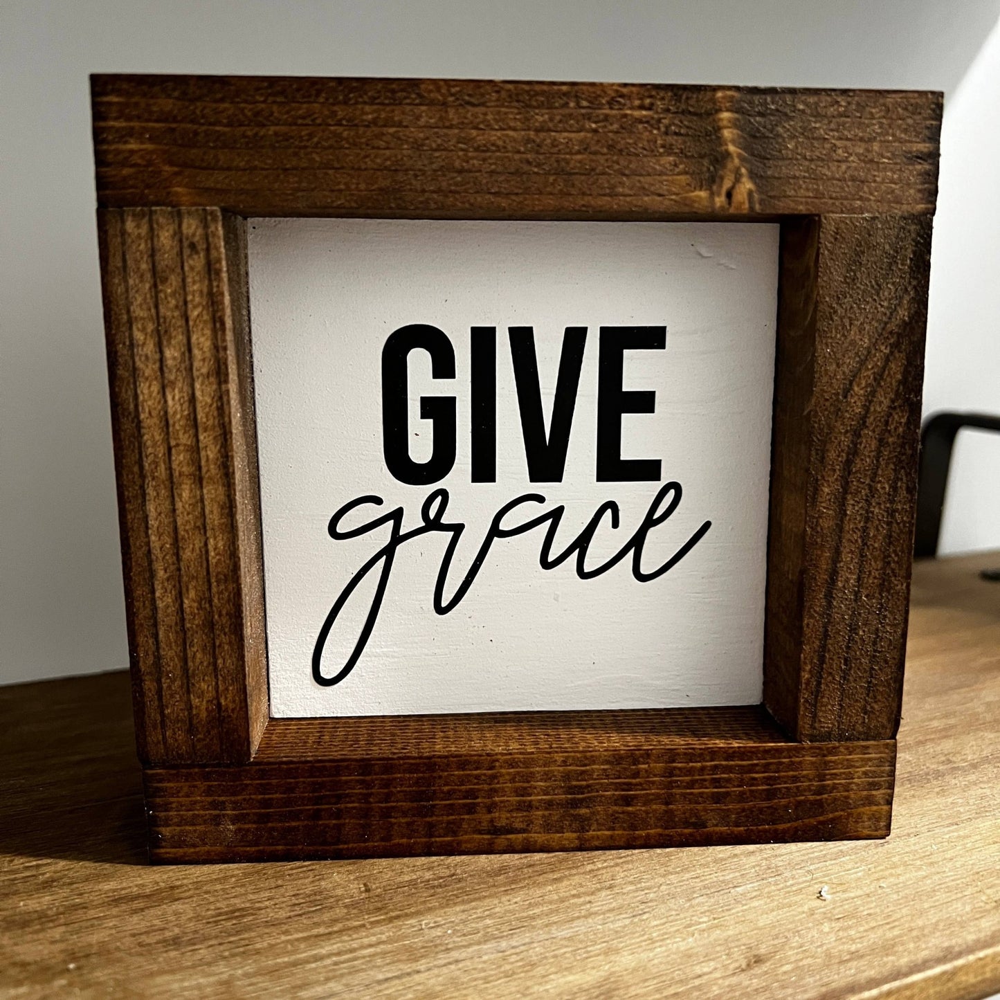 a picture frame with the words give grace on it