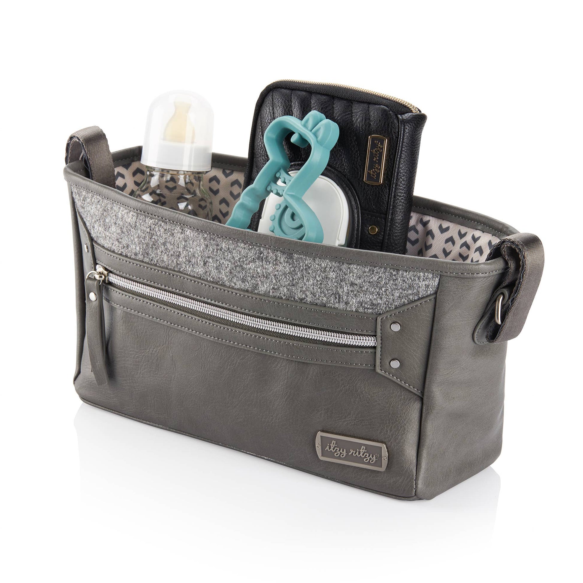 a gray stroller caddy with a pair of scissors in it