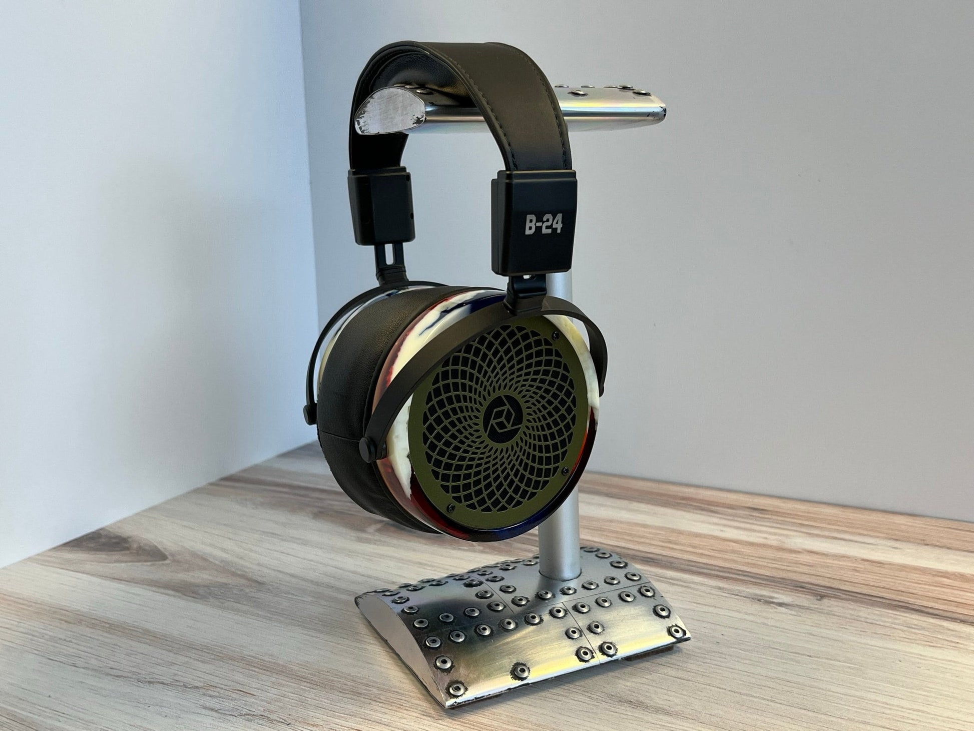 a pair of headphones sitting on top of a stand