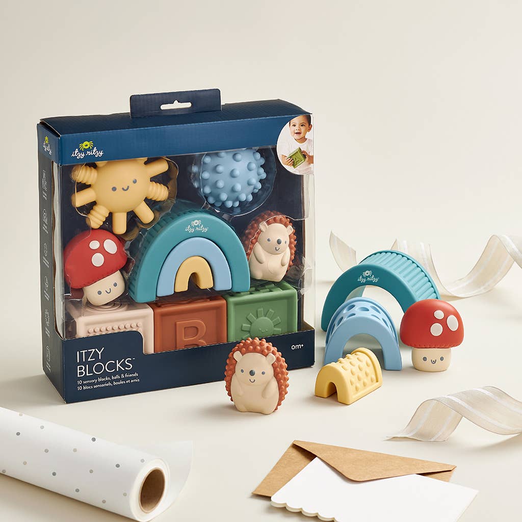 a box of wooden toys sitting on top of a table