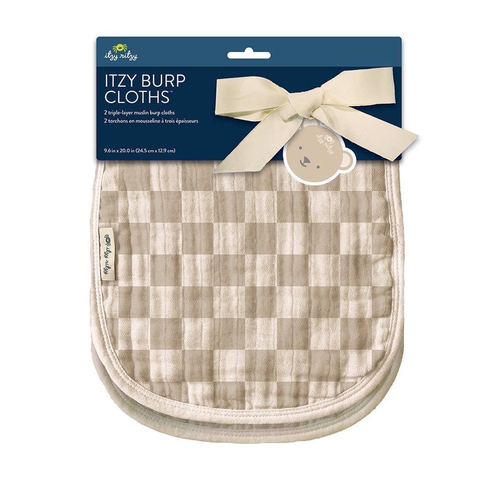 a burp cloth with a white bow on it