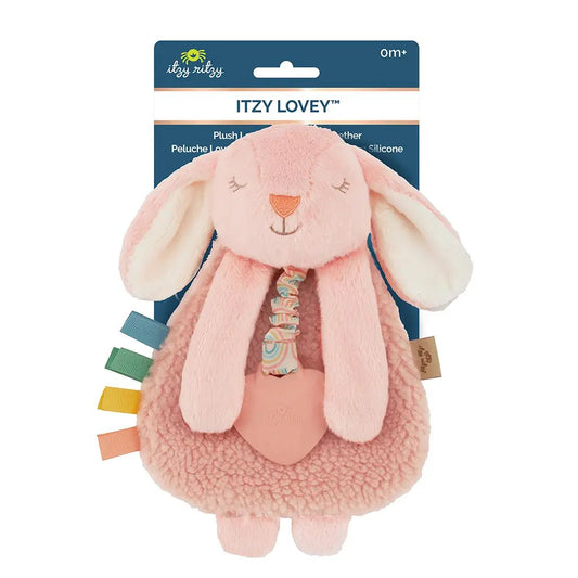 a pink stuffed animal with a tag on it