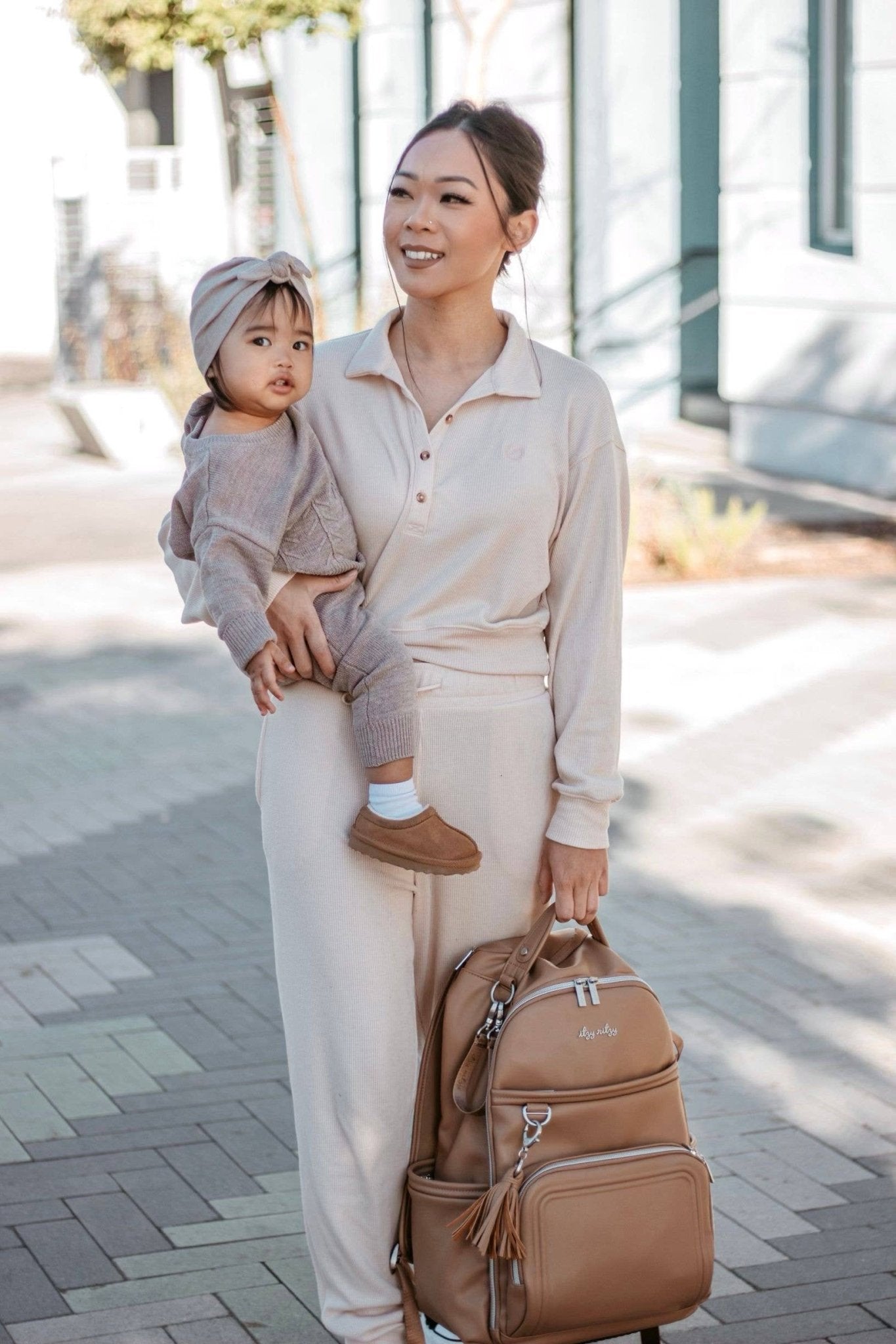 a woman holding a baby in her arms