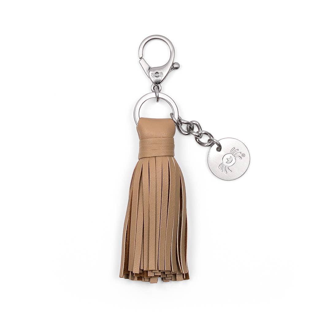 a tan leather tassel keychain with a round metal key ring