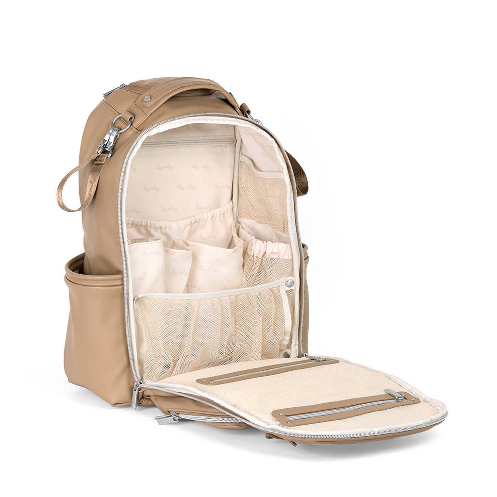 an open backpack with a diaper bag inside of it