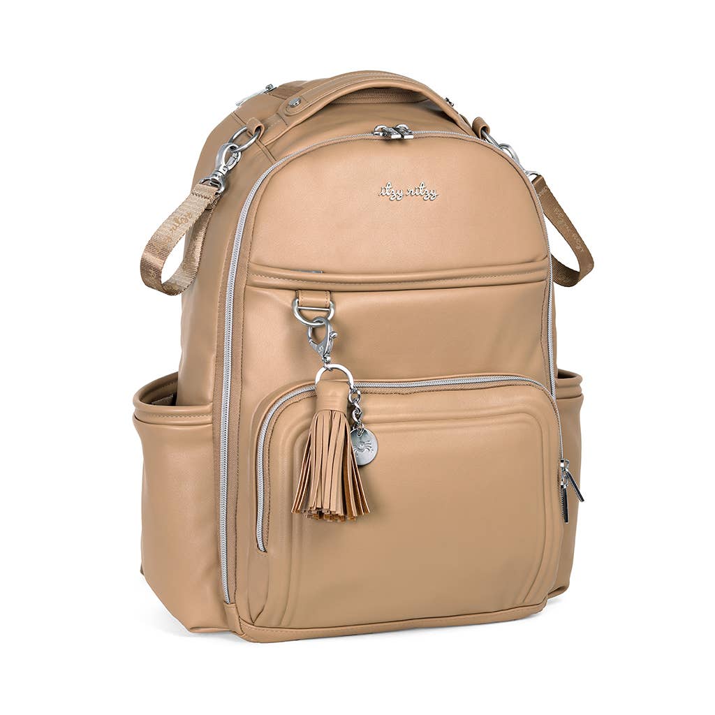 a tan leather backpack with a tassel