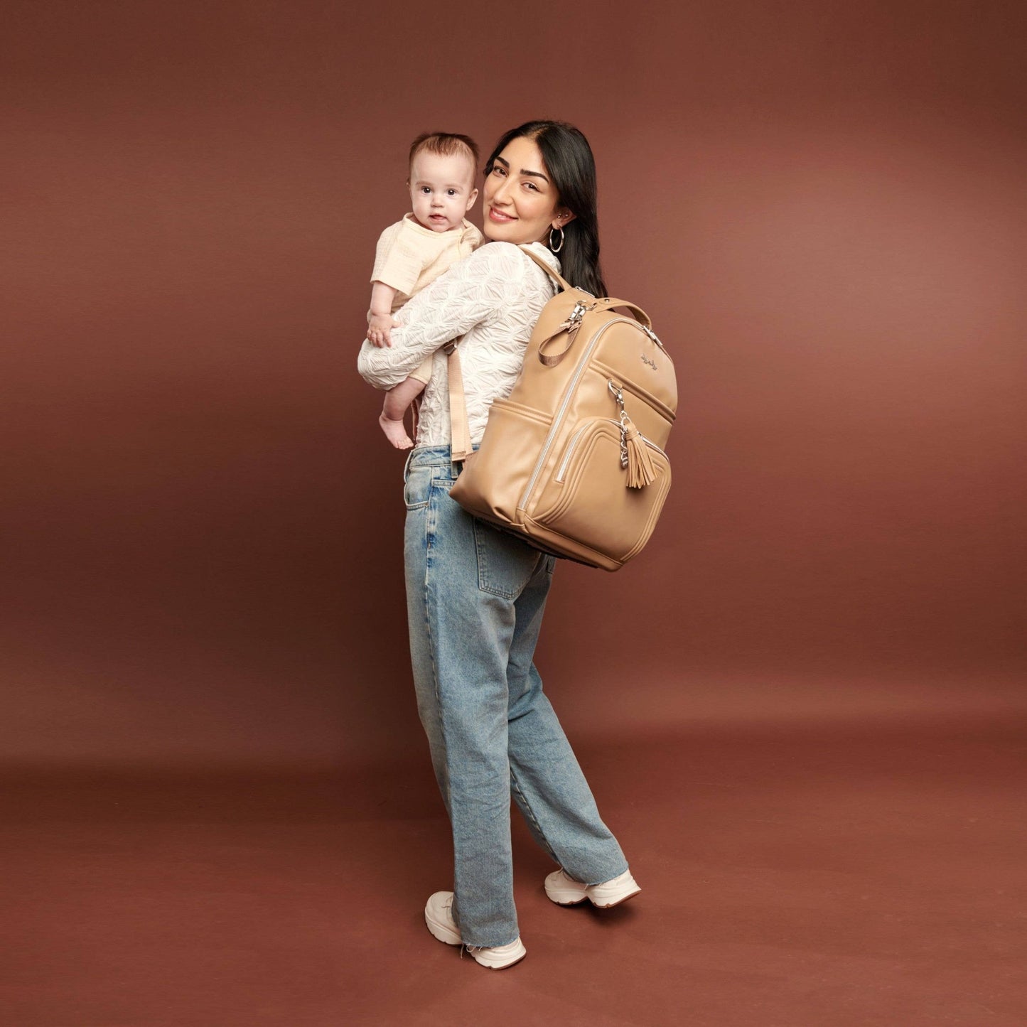 a woman holding a baby in her arms