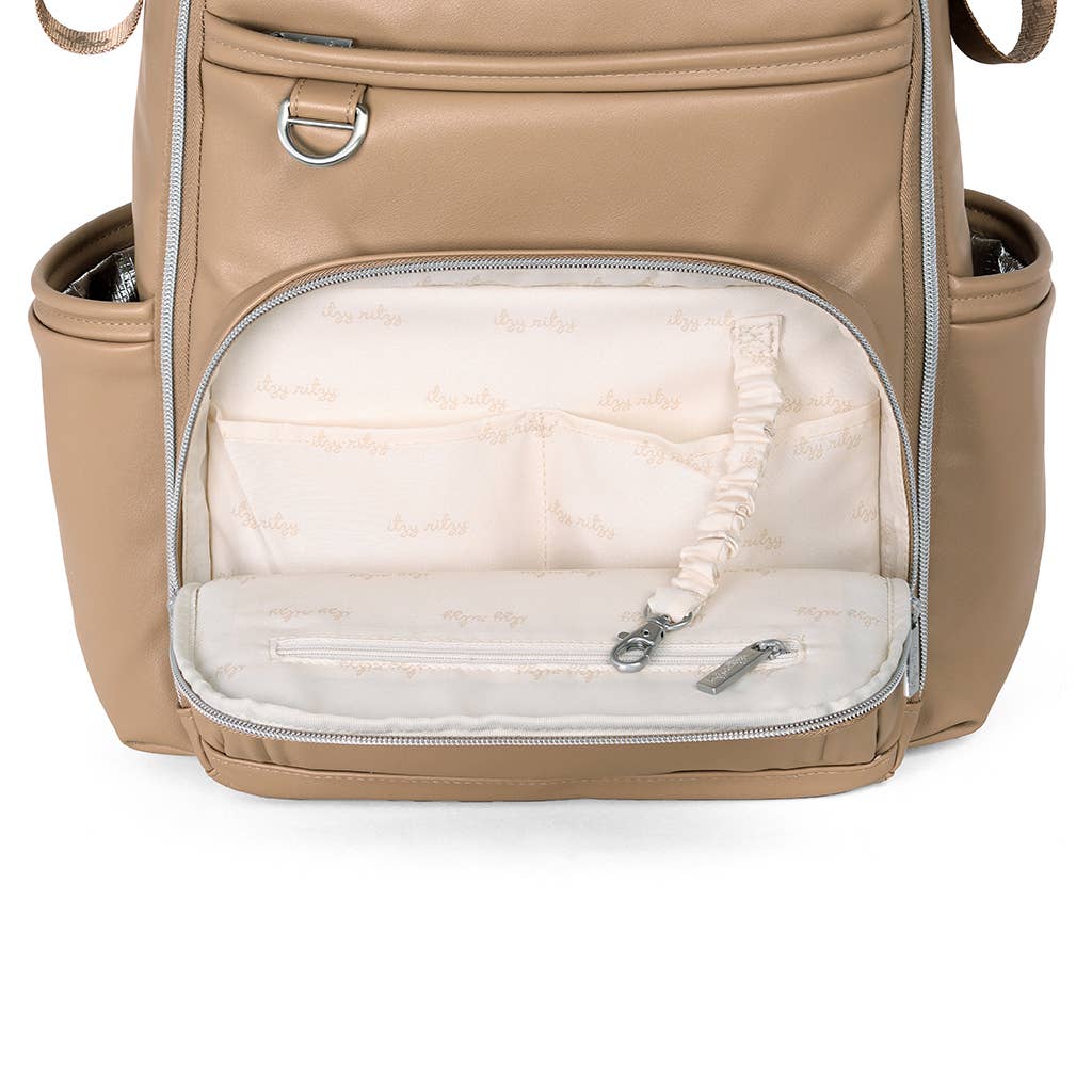 a tan backpack with a white pillow inside of it