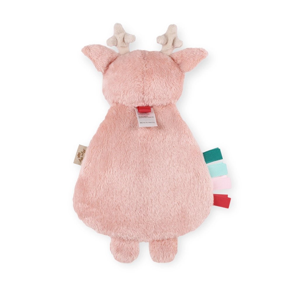 a pink stuffed animal with antlers on its head