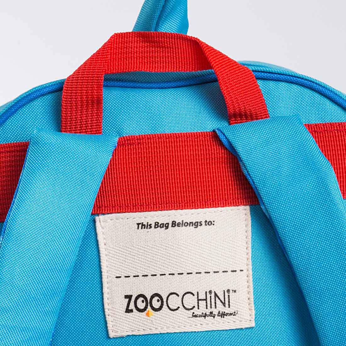 a close up of a blue backpack with a tag on it