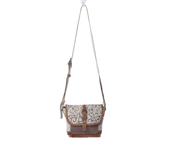 a purse with a handle hanging from it