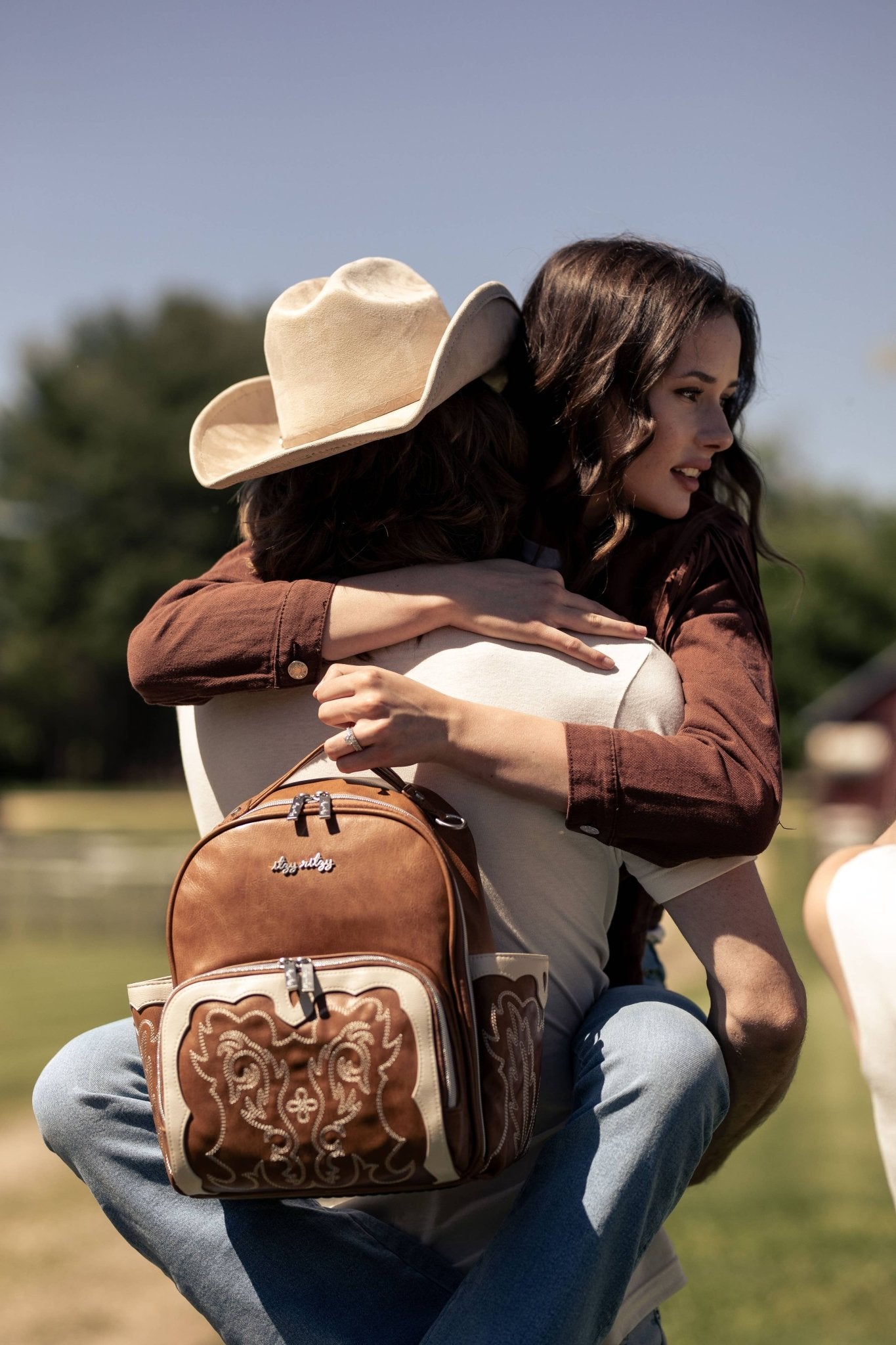 a couple of people that are hugging each other