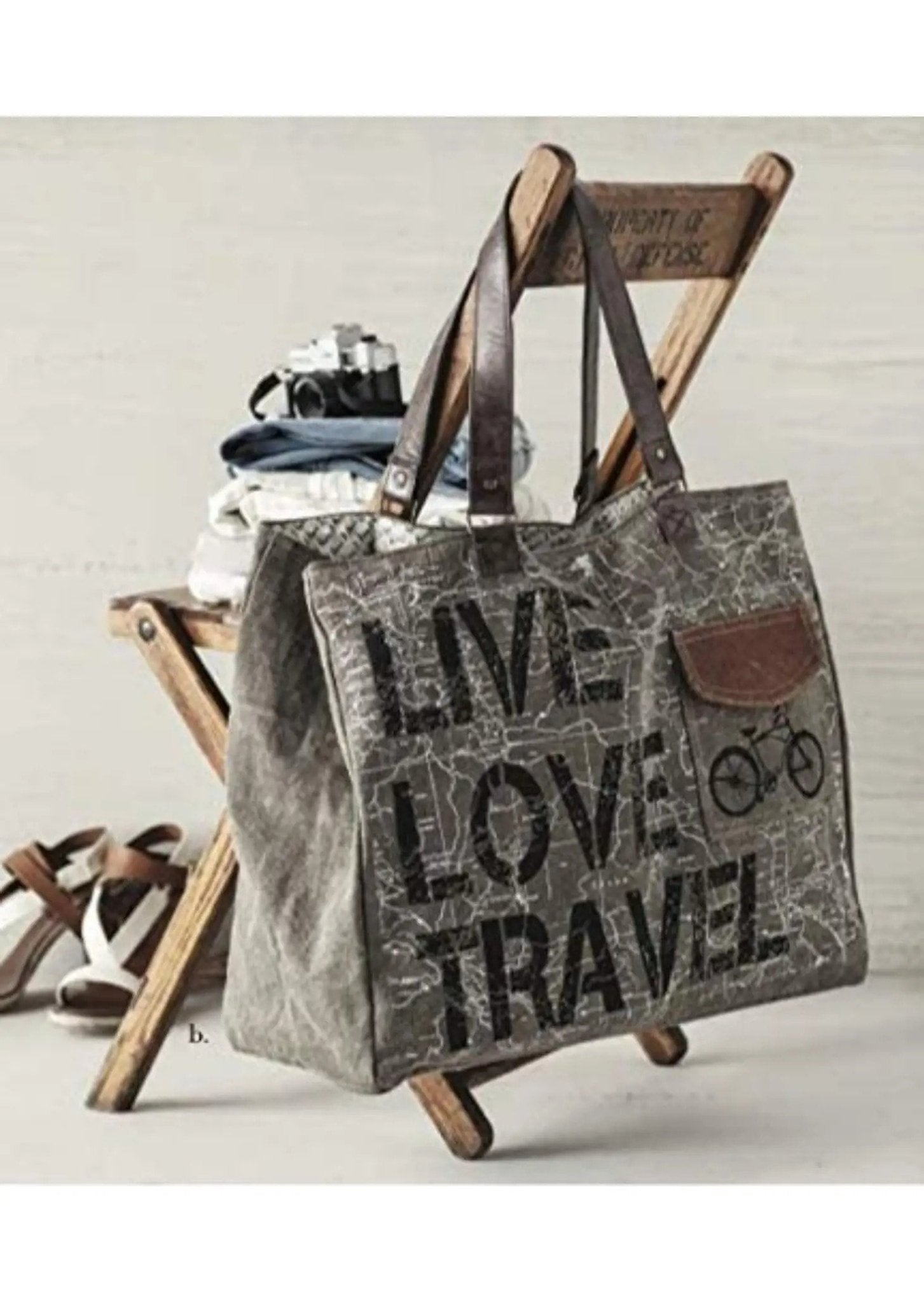 a bag sitting on top of a wooden chair