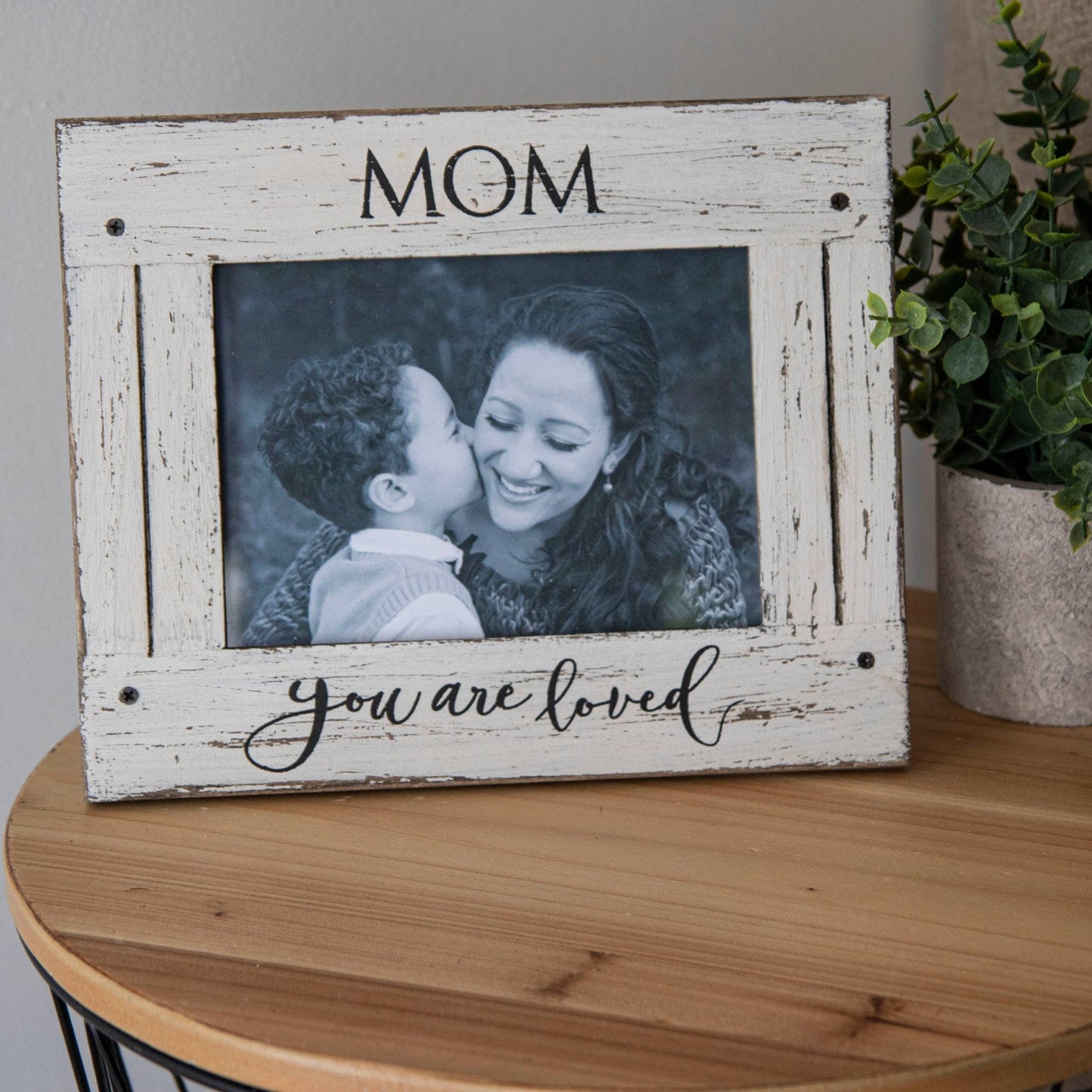 a picture frame with a picture of a mother and child