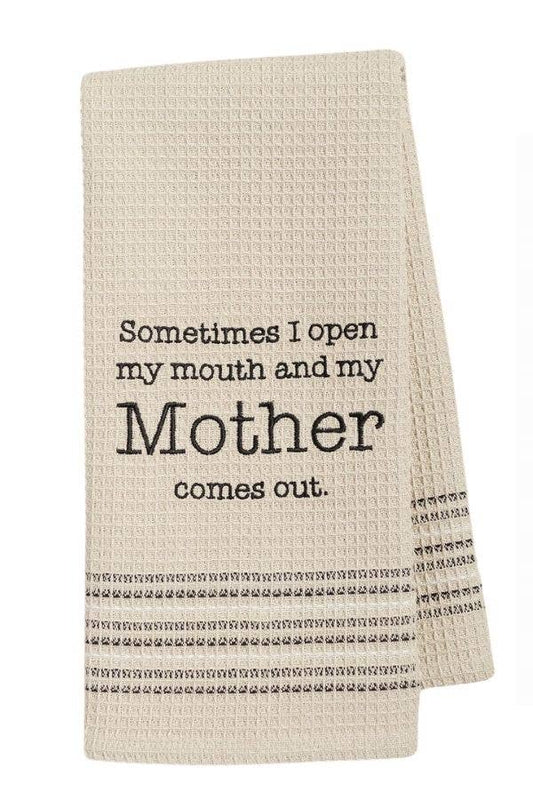 a khaki towel with the words Sometimes I open my mouth and my Mother comes out on it