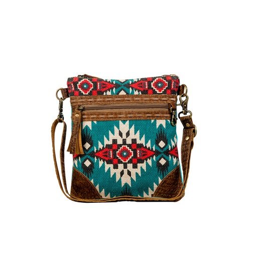 a cross body bag with a southwestern design