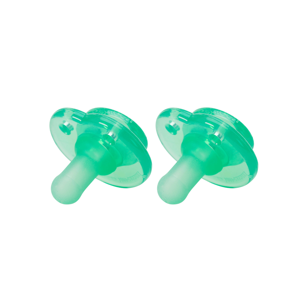 a pair of green ear plugs on a white background