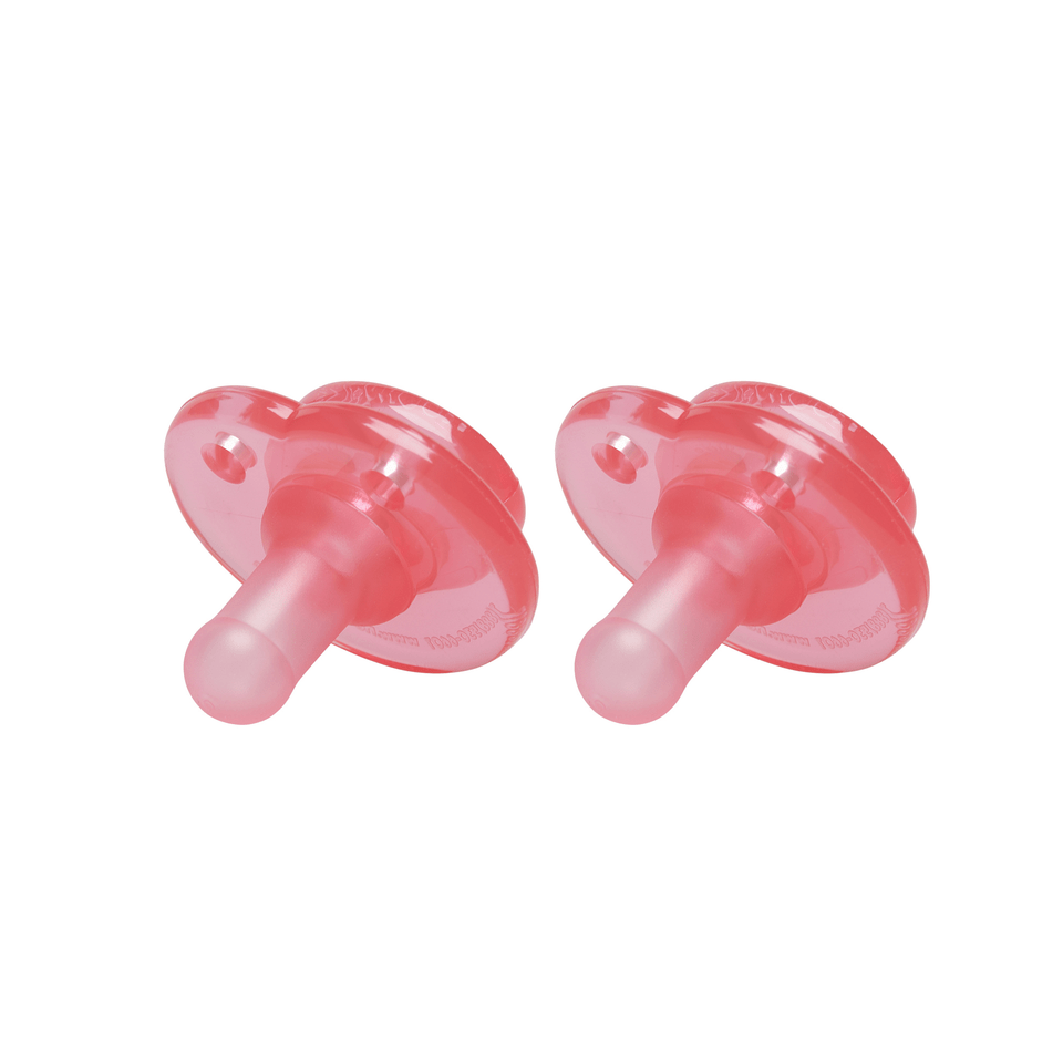 a pair of pink pacifiers on a white background