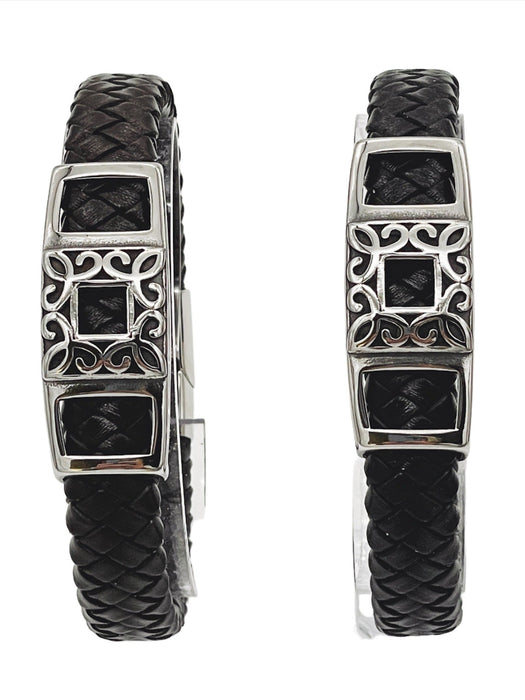 a pair of black leather bracelets with silver accents