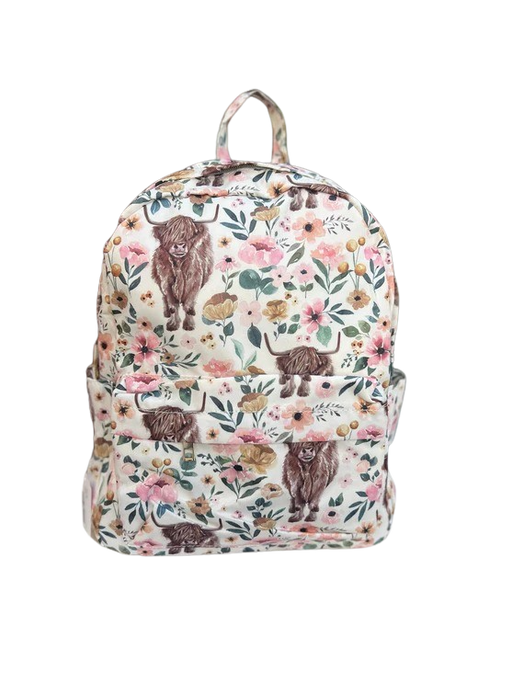 a white backpack with brown bears and flowers on it