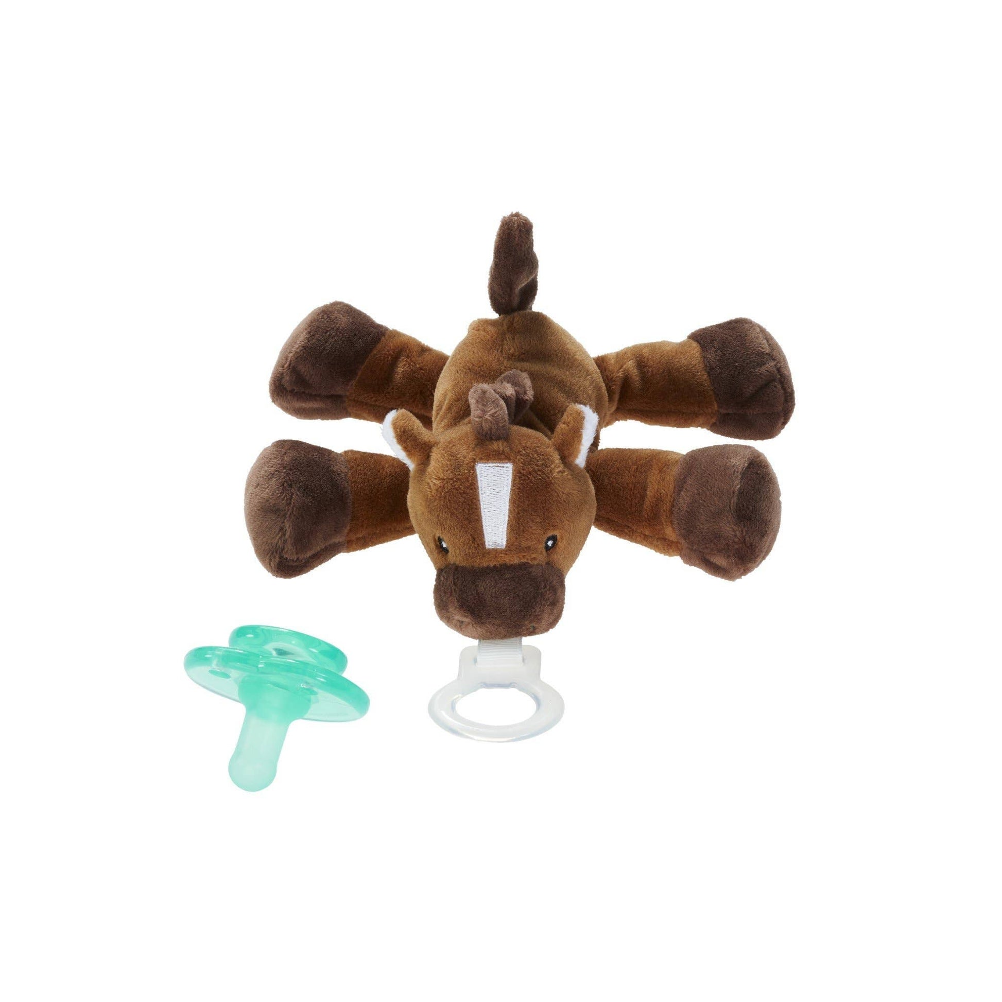 a stuffed giraffe toy with a pacifier in front of it