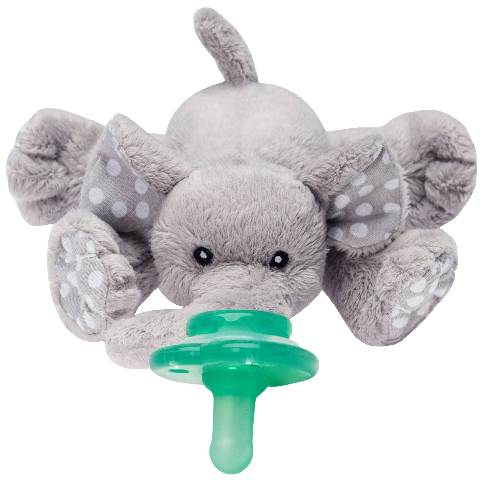 a stuffed elephant with a pacifier on its mouth