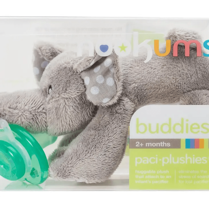 a stuffed elephant with a pacifier on its mouth