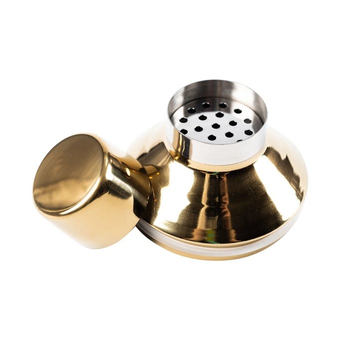 a brass plated shaker with a strainer