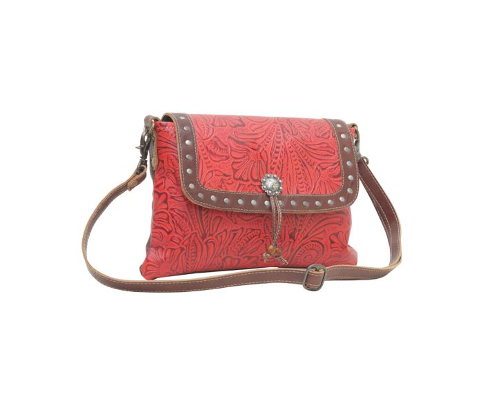 a red purse with a brown strap