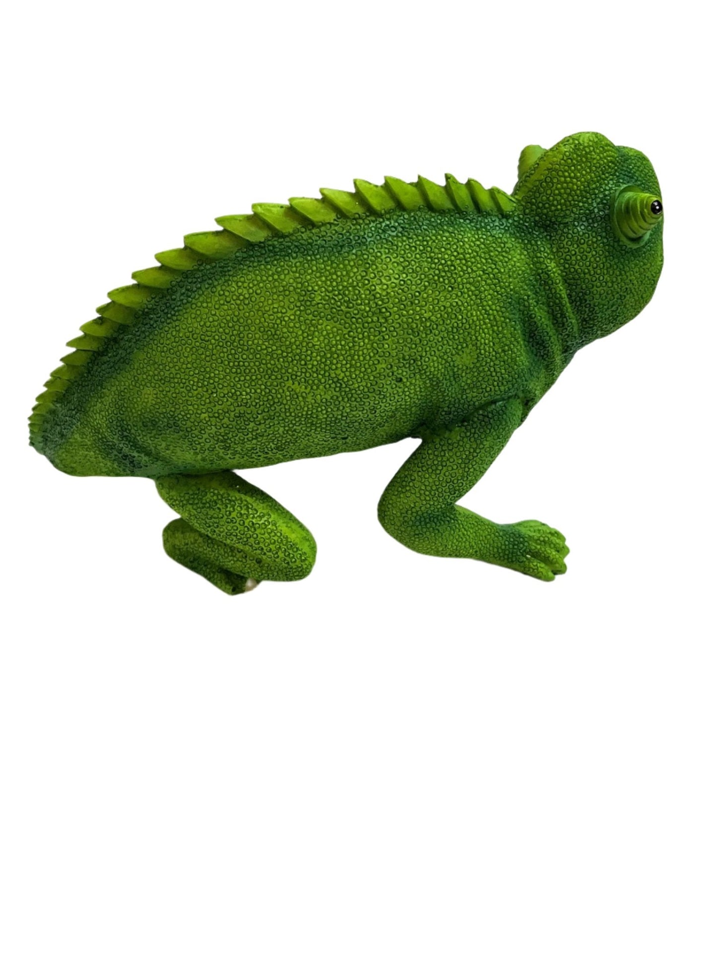 a green chameleon sitting on top of a white surface