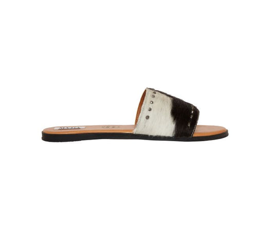 a pair of black and white sandals on a white background