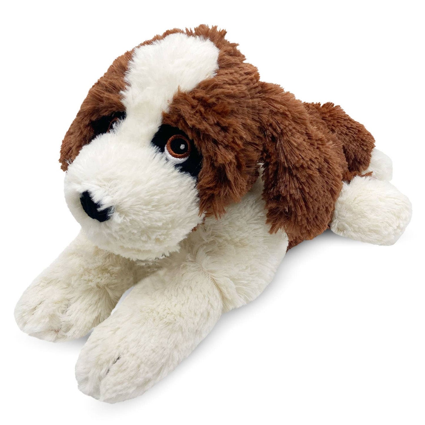 a brown and white stuffed dog laying down