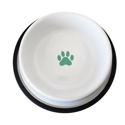 a white bowl with a green paw print on it