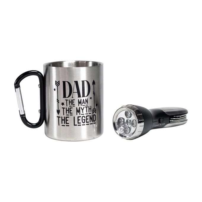 a stainless steel mug with a flashlight beside it