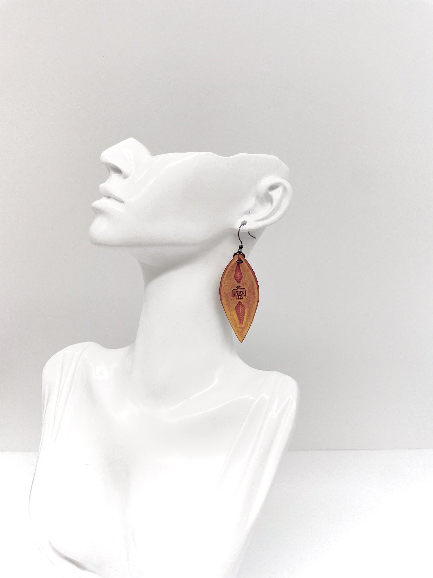 antique brown teardrop leather thunderbird stamped earring