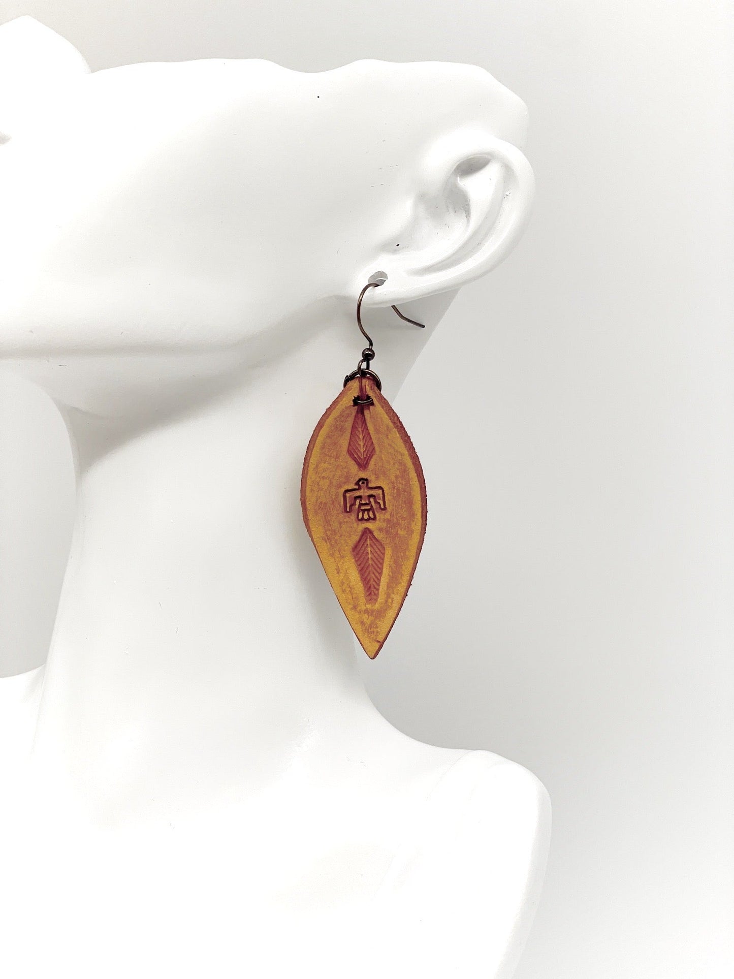 antique brown teardrop leather thunderbird stamped earring