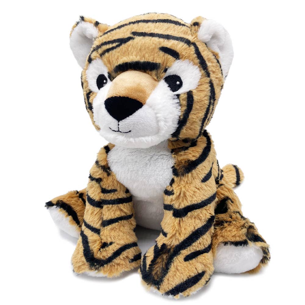 a stuffed tiger sitting on top of a white floor