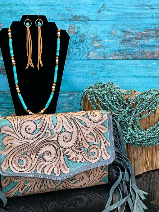 turquoise leather tooled purse with fringe