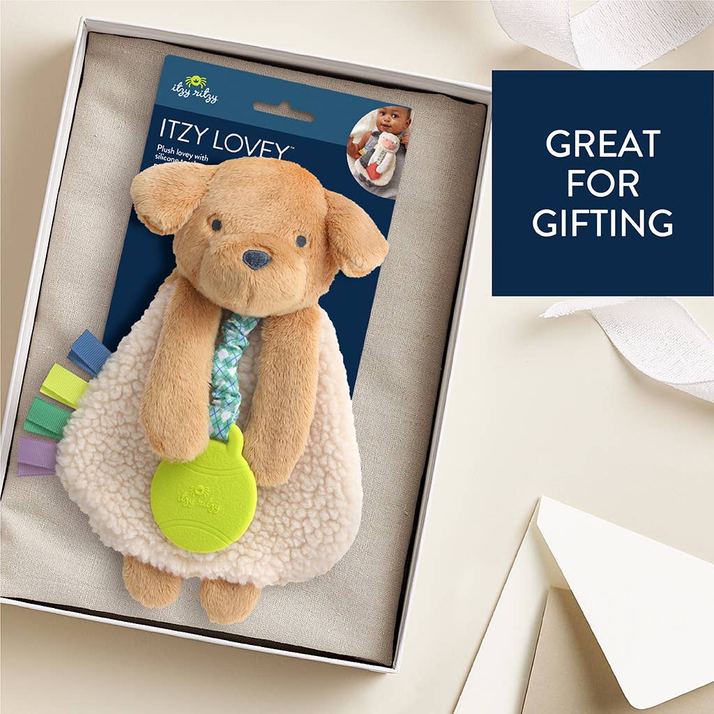 a teddy bear in a gift box with a tag