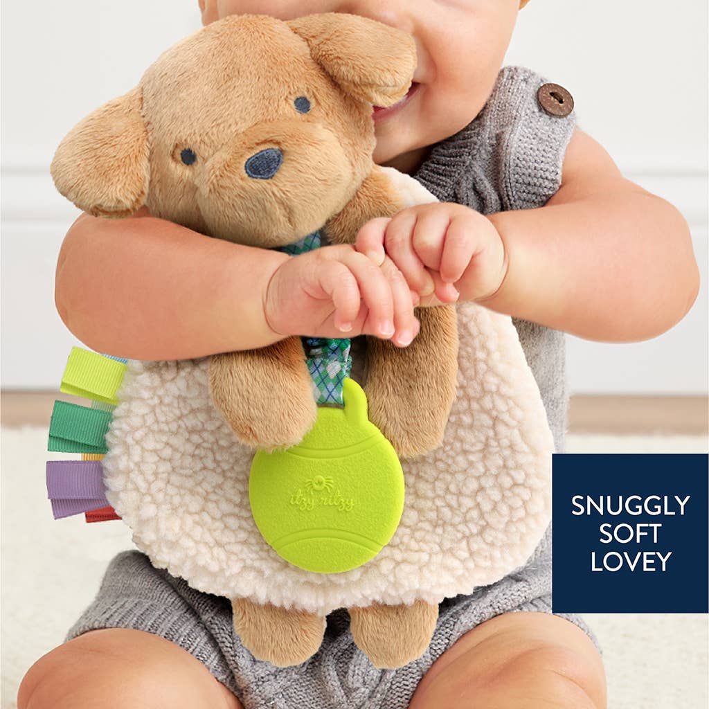 a baby holding a stuffed animal in his arms