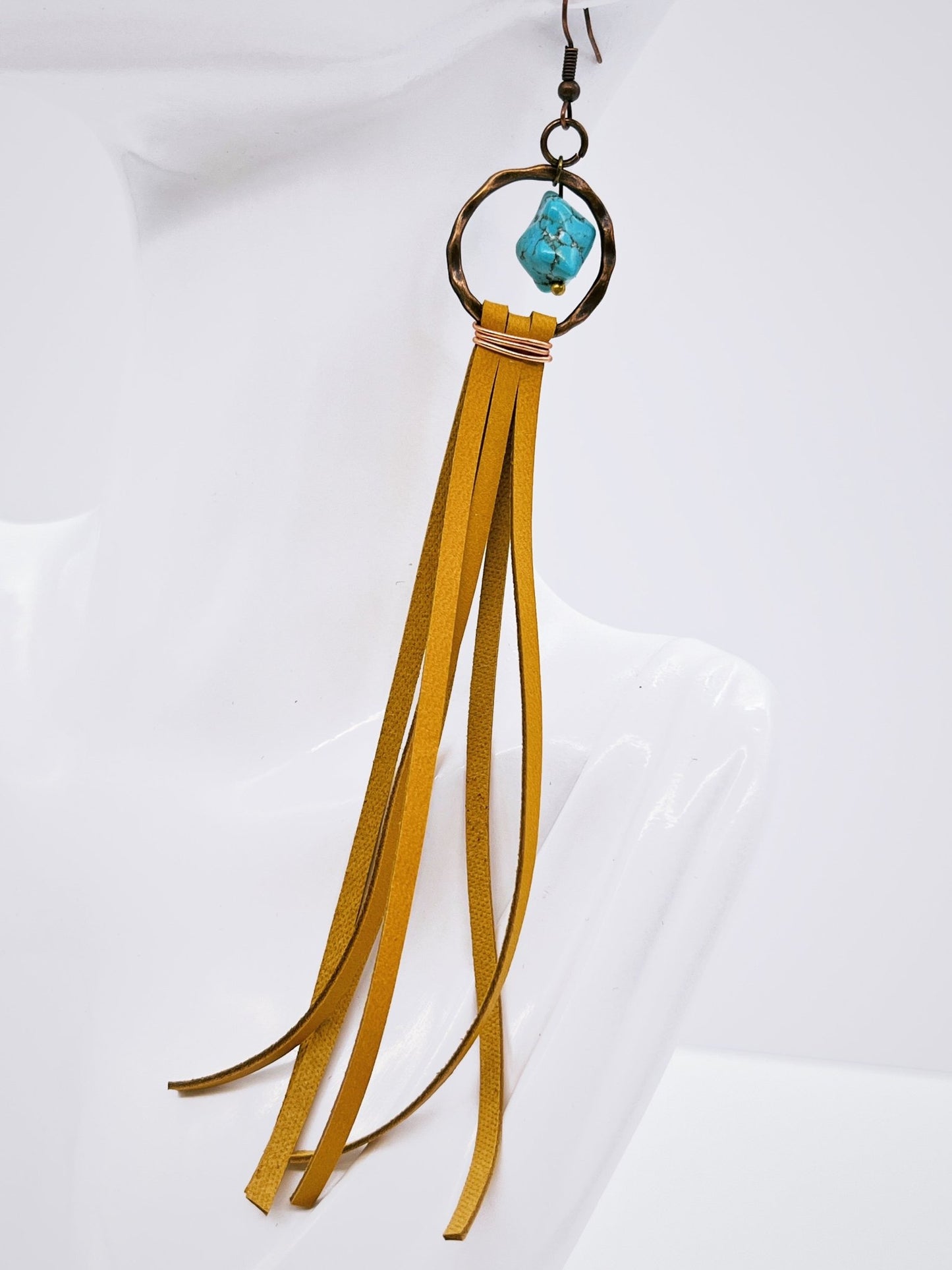 Turquoise Drop Earring with Leather Tassel Mustard on mannequin display