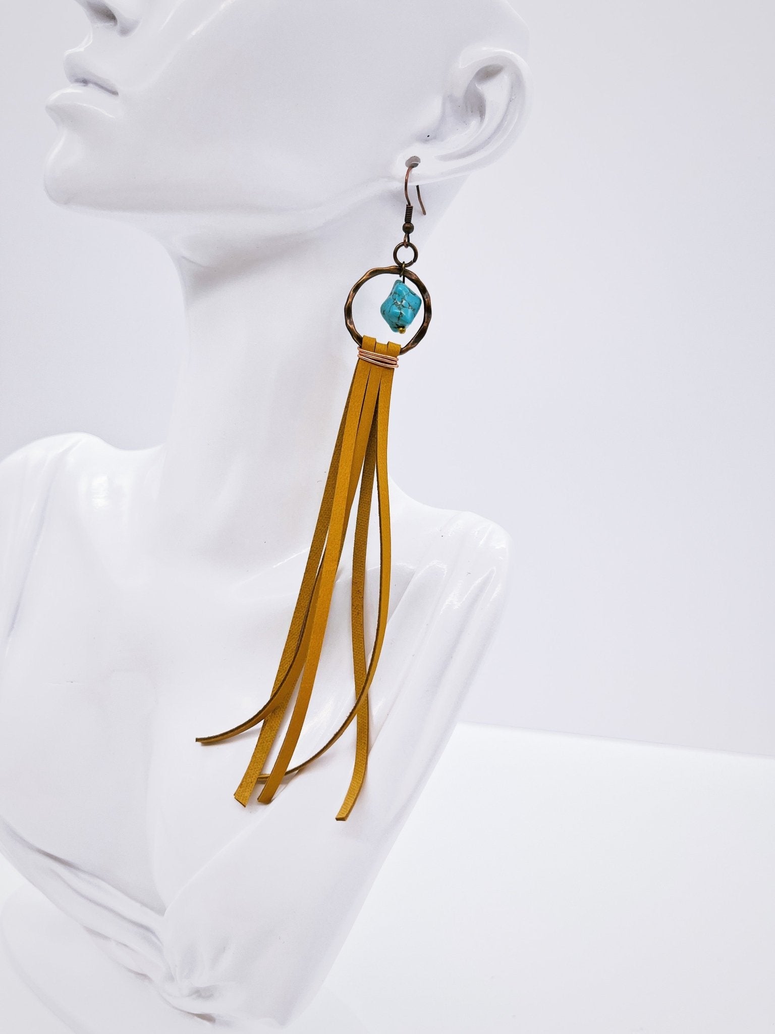 Turquoise Drop Earring with Leather Tassel Mustard on mannequin display