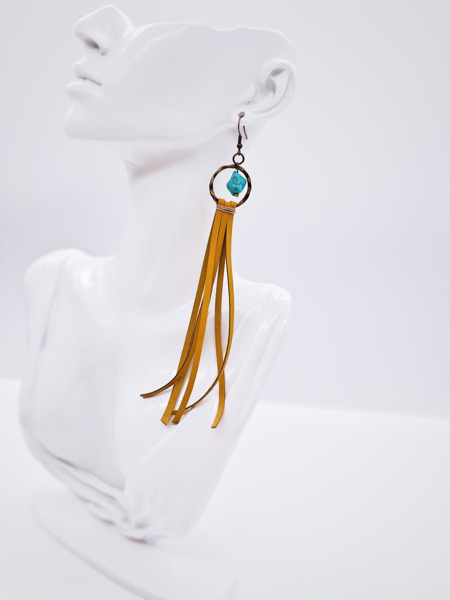 Turquoise Drop Earring with Leather Tassel Mustard on mannequin display